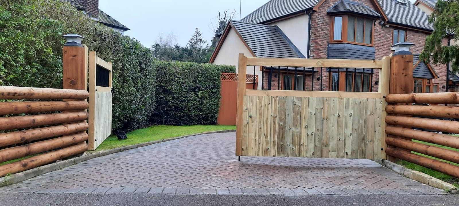 Double wooden driveway gates