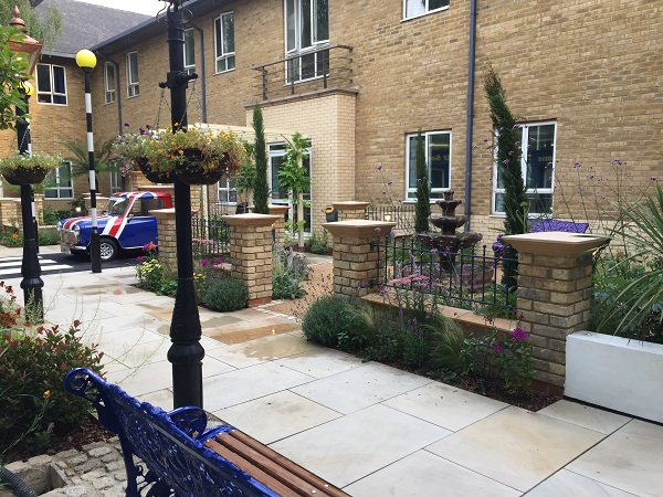 Ball top design wrought iron railings fitted on top of brick wall