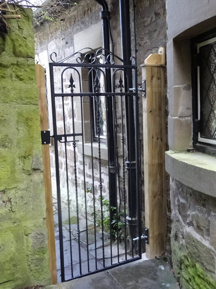 Windsor iron security gate fitted to side of house