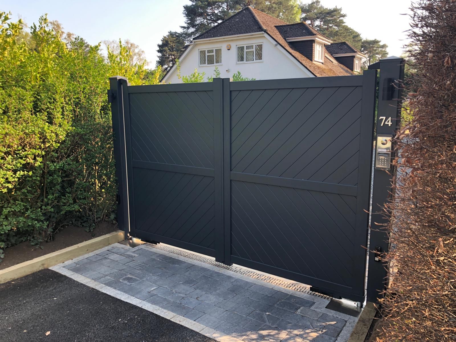 Anthracite grey diagonal boarded double aluminium gates fitted to posts