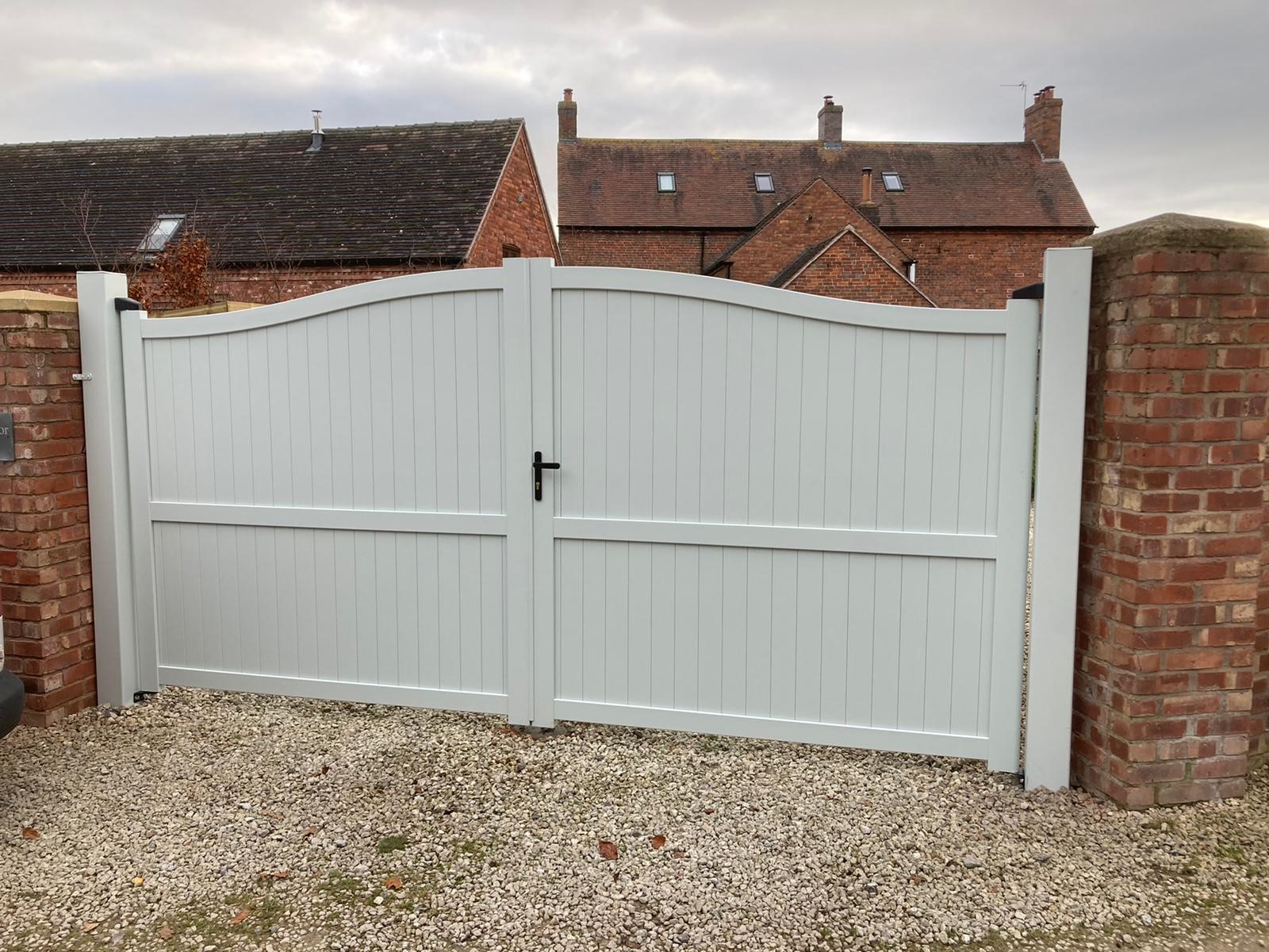Arched double aluminium driveway gates in a non standard RAL colour