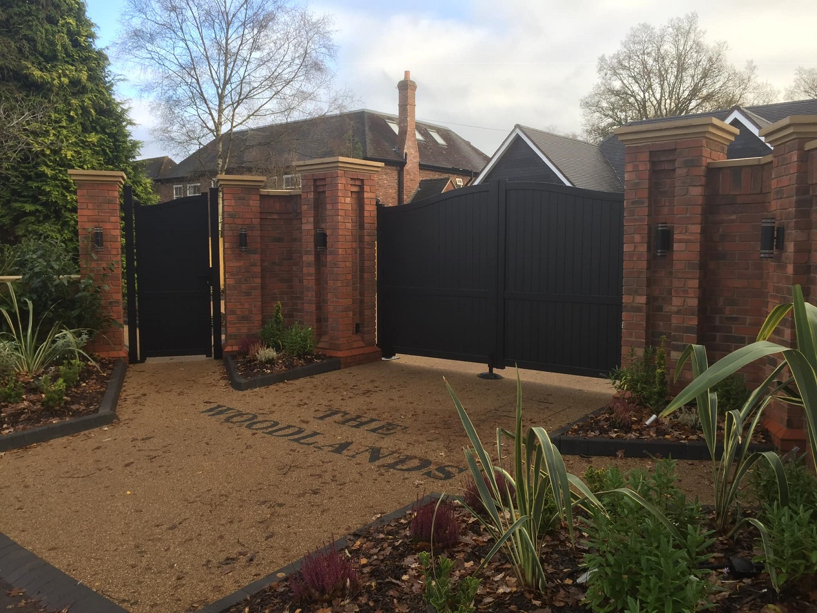 Aluminium arched driveway gates with a modern design