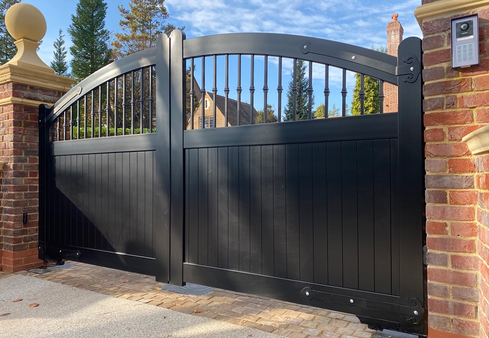 Arched aluminium driveway gates painted black