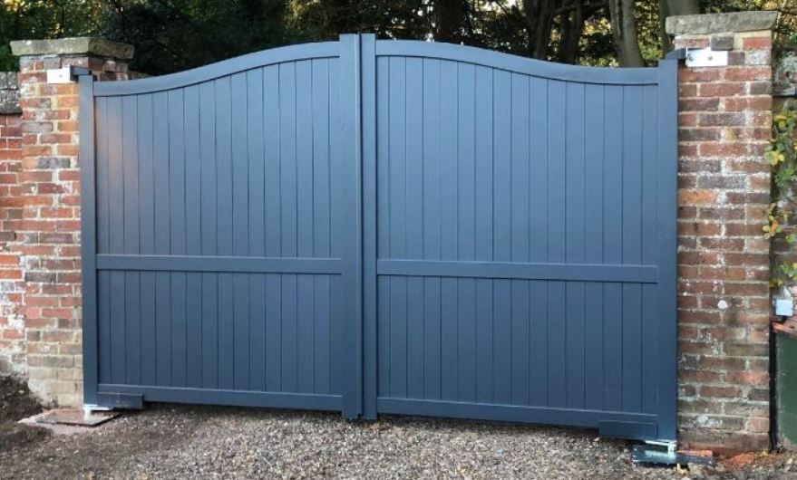 Arched aluminium double gates fitted to large driveway entrance