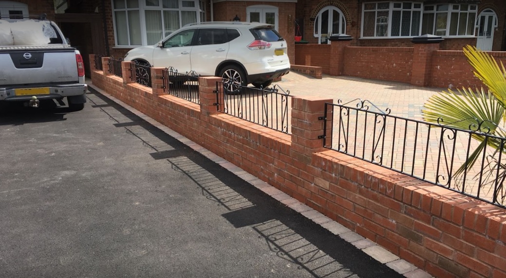 Clifton metal wall top railings mounted btween brick pillars