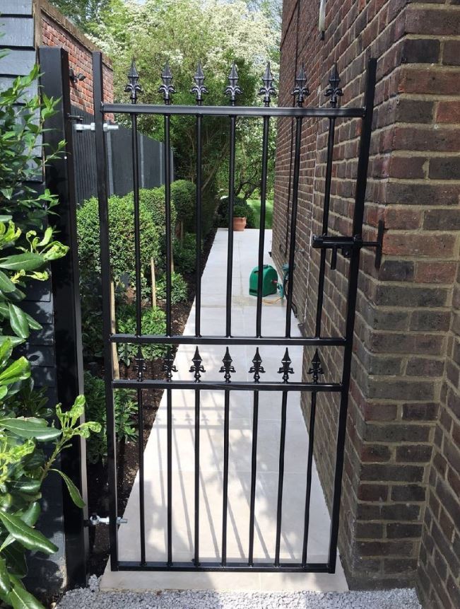 Corfe side gate fitted to path between house and fence