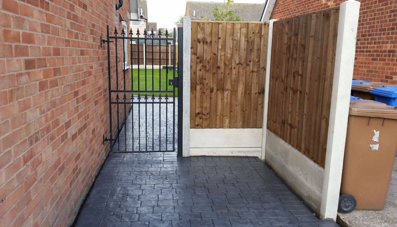 Corfe metal gate design fitted to house wall