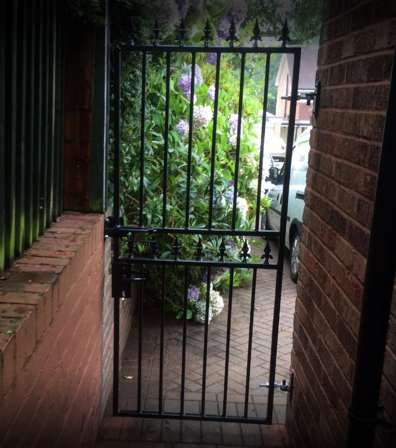 Hampton box section steel security gate in a small passageway