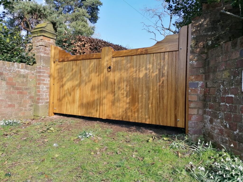 Idigbo bespoke driveway gates with gun stock top rail