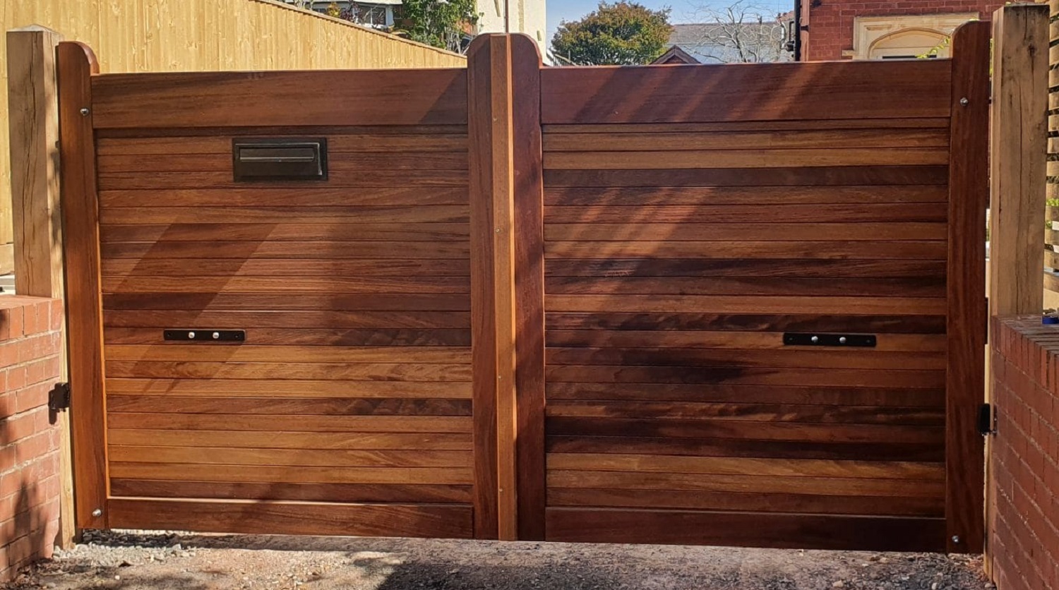 Iroko custom made flat top driveway gates with horizontal boards