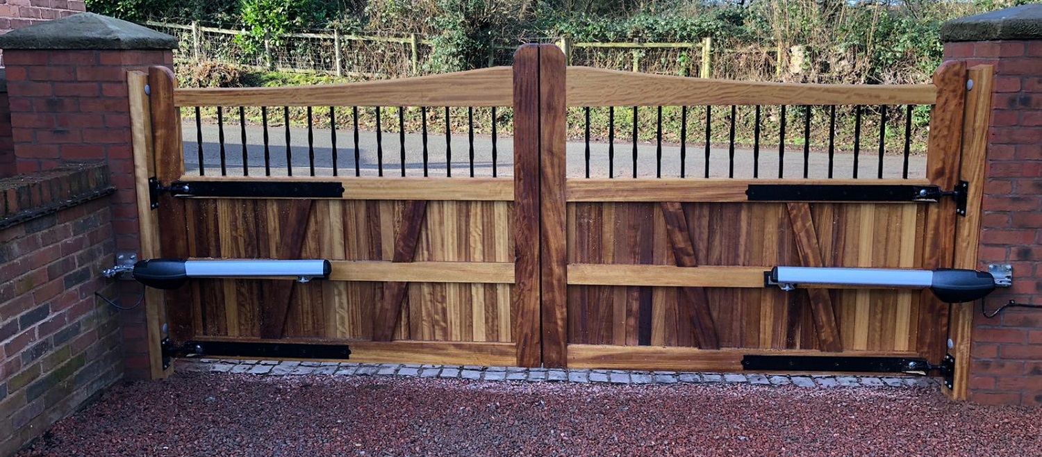 Rear face of iroko driveway gates with slope top
