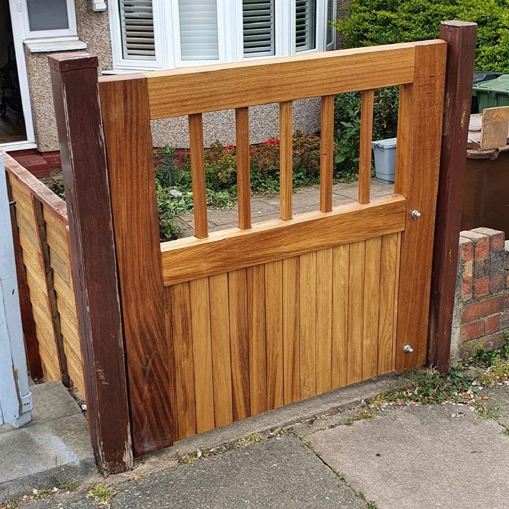 Iroko flat top garden gate with open pale and spindles