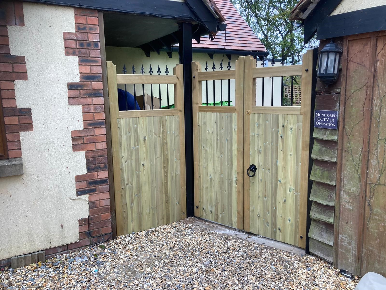 Matching wooden fence panel and gate design