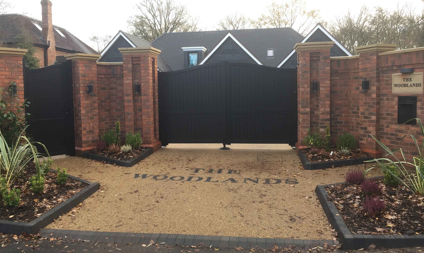 Aluminium gates fitted to large driveway entrance with matching curved pedestrian gate