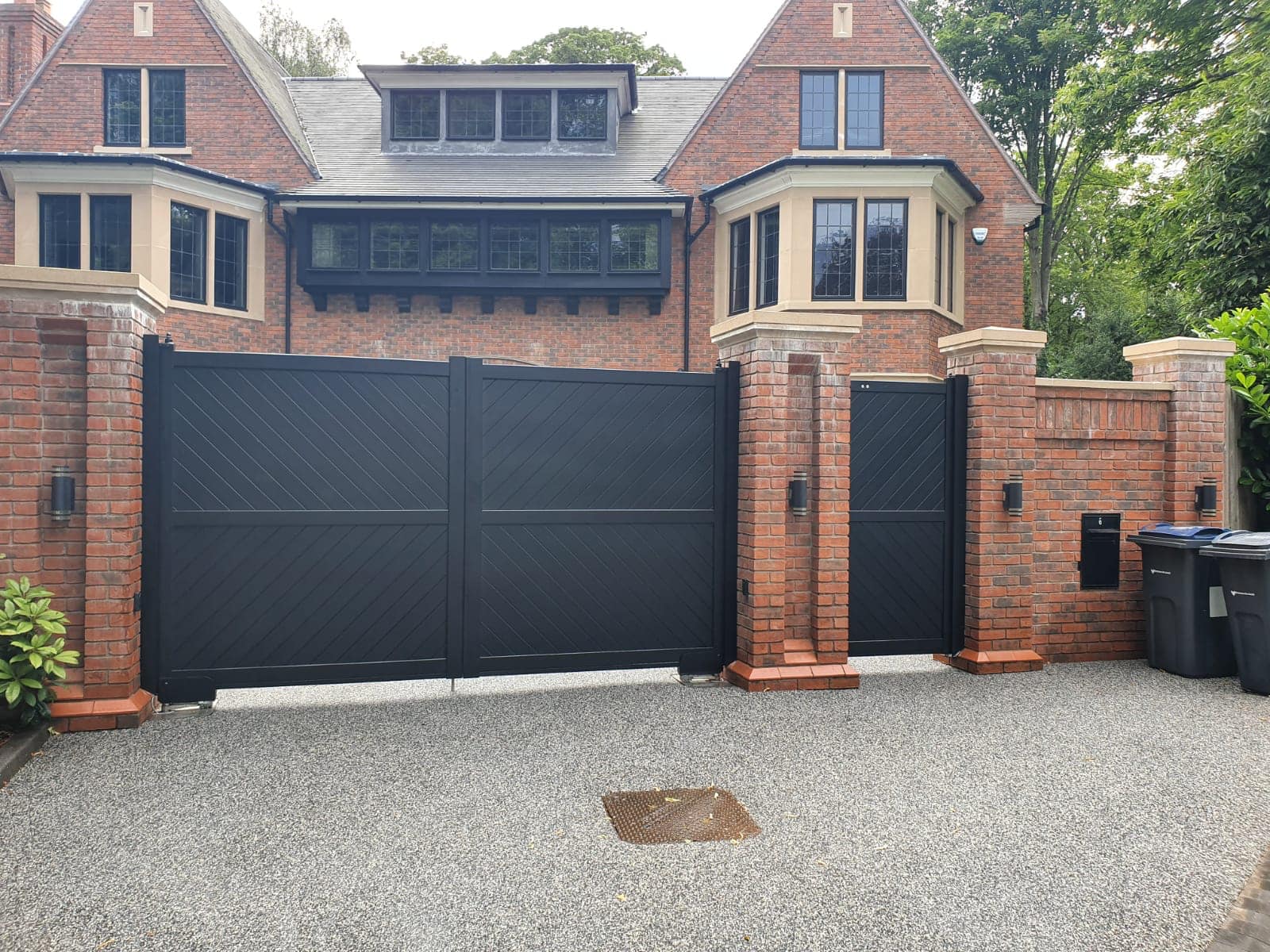 Modern aluminium gates showing a double and single