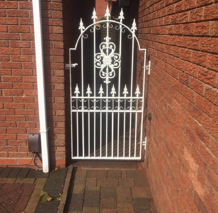 Metal garden gate painted white