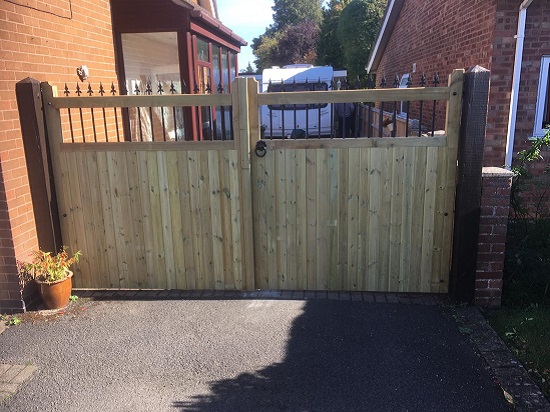 Spear top wooden gates securing residential driveway