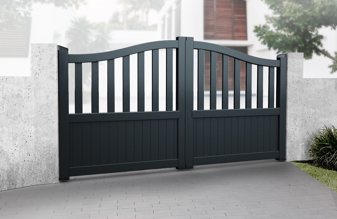 Vertical boarded aluminium driveway gates with an arch top and long open pales in black