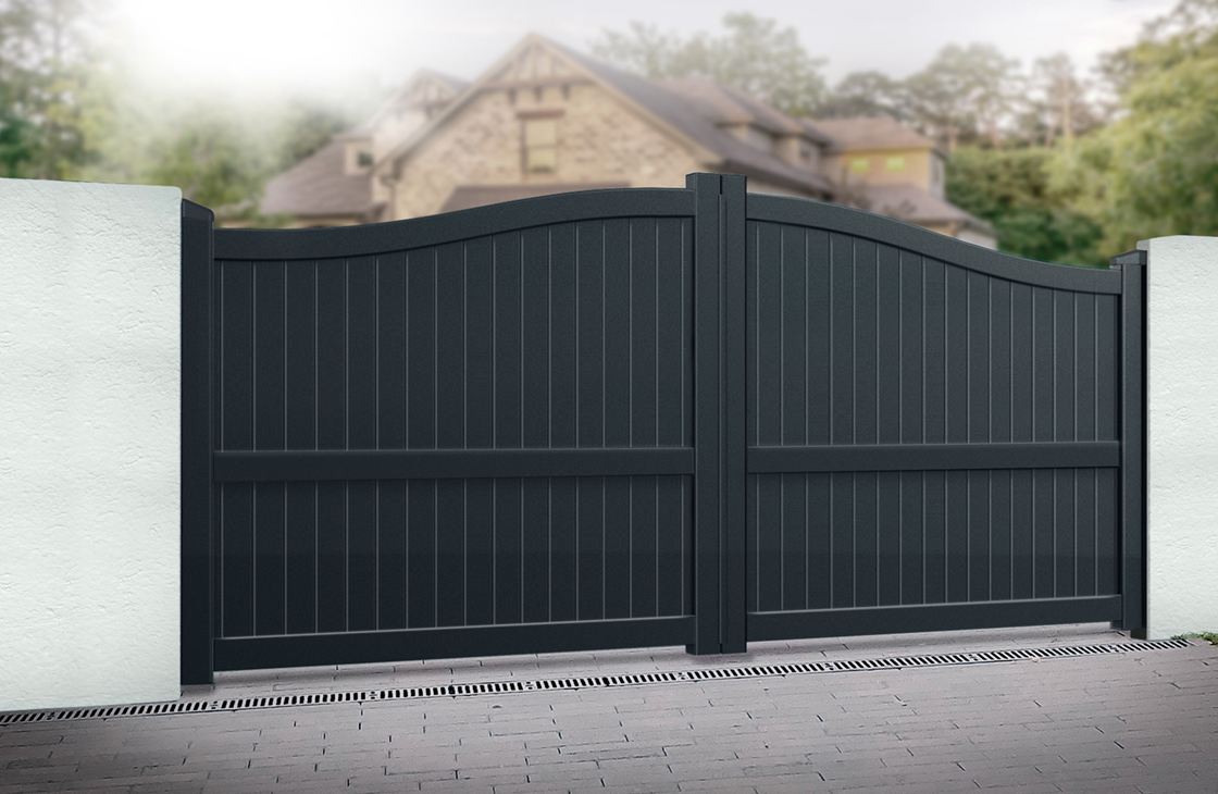 Vertical boarded aluminium driveway gates with an arch top in black