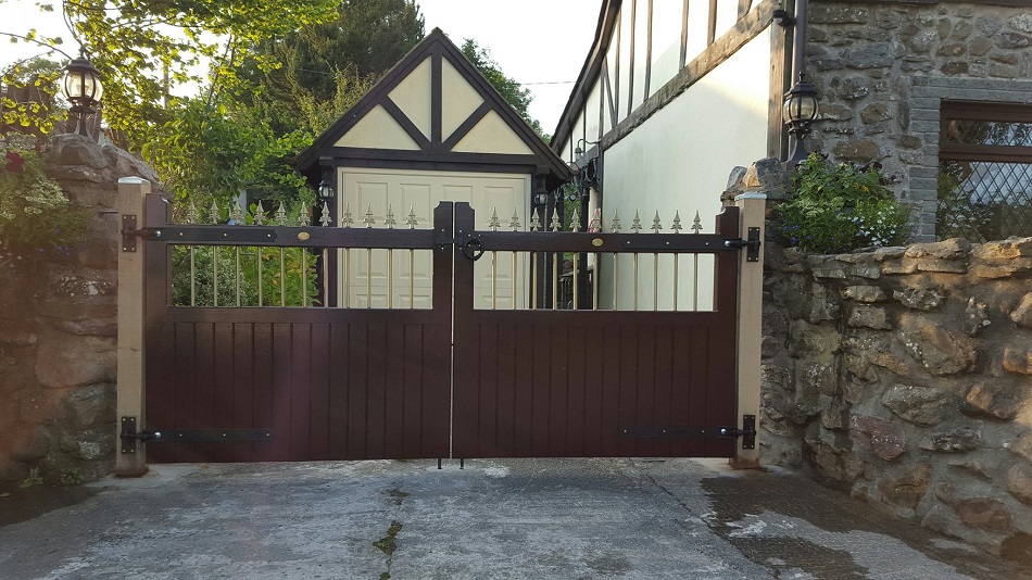 Vertifleur wooden driveway gates with a dark walnut stain