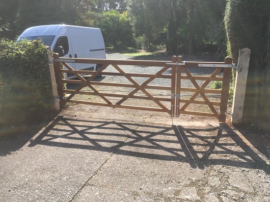 Wooden field gates fitted to large driveway entrance