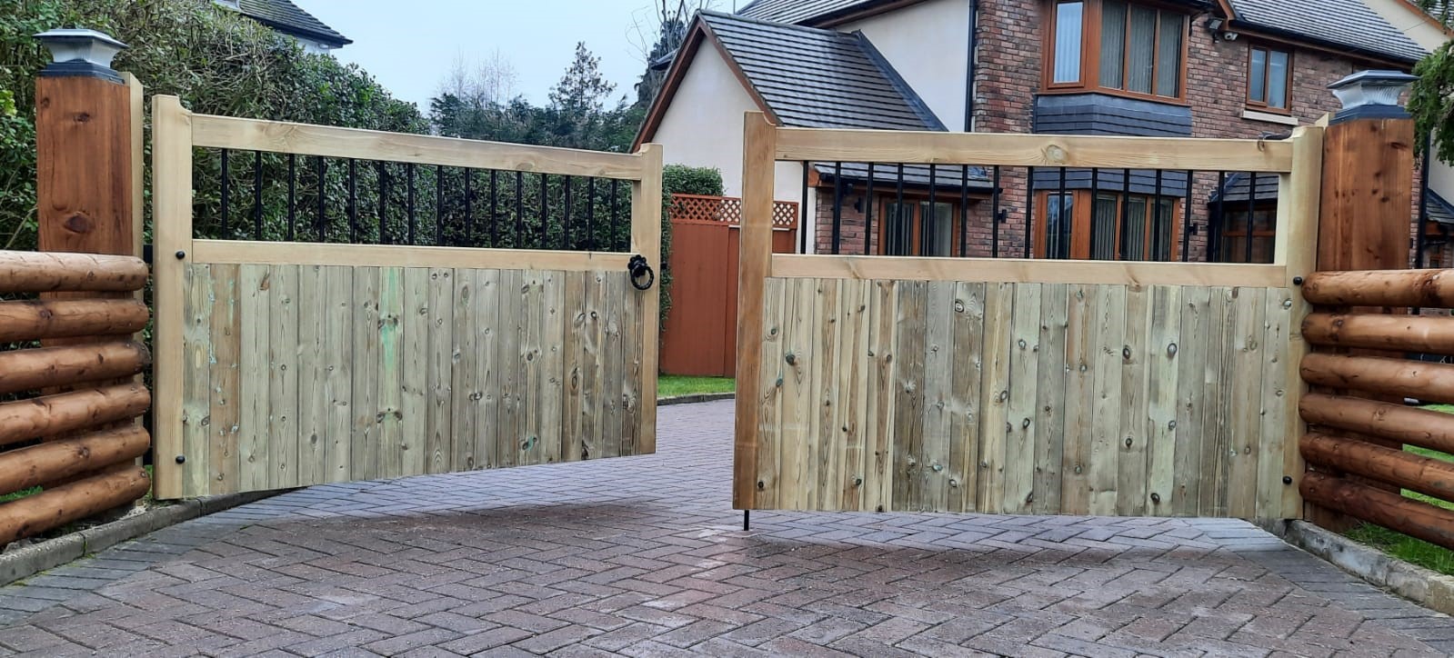 Bordeaux wooden driveway gates fitted to timber posts
