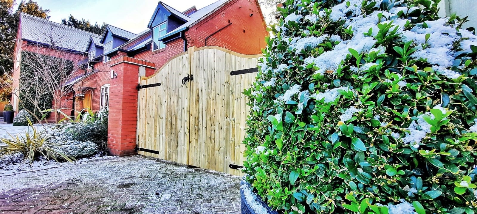 Wooden gates covered in snow during the winter